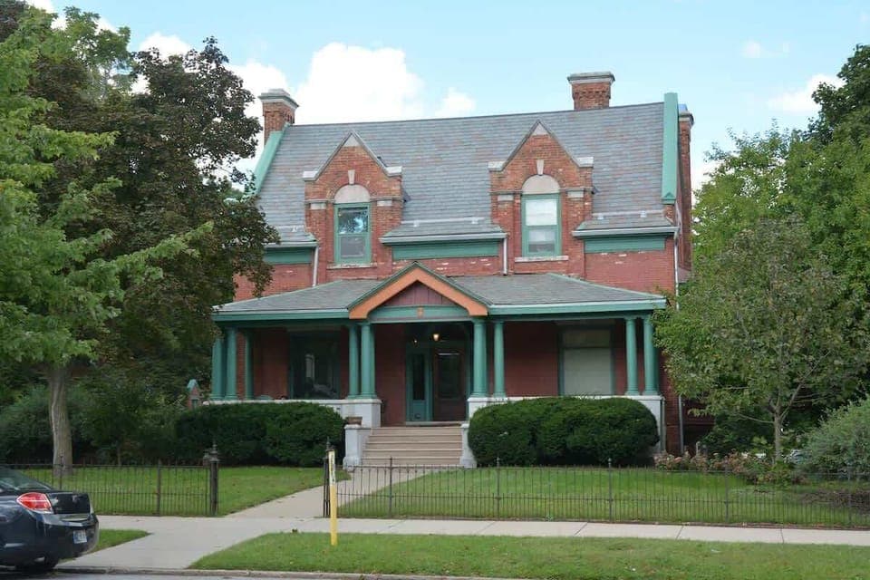 This former home of Peter Studebaker of the Studebaker family was built in 1895. This building is in the Queen Anne style architecture. There is a private parking lot which can be access by a brick driveway located to the left (west) of the building.