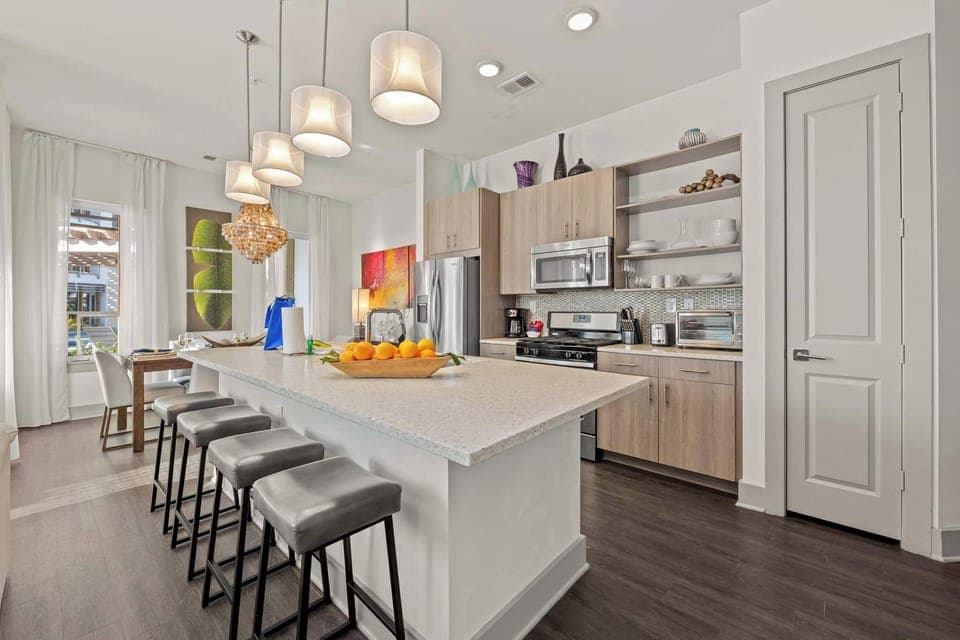 Designed for connection. Enjoy a social kitchen with breakfast bar seating that flows seamlessly into an elegant dining area—ideal for group stays at the coast