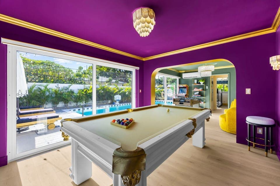 Enjoy a fun game of pool while staying right in the middle of the action with views of the backyard pool and quick access to the arcade and foosball nearby!