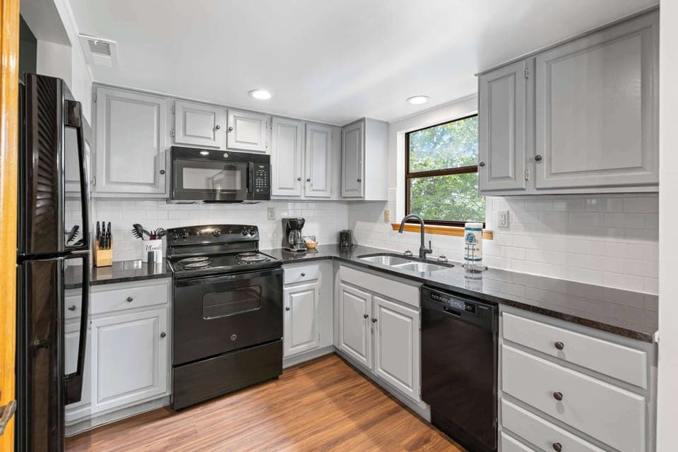 Modern appliances and sunlit views make cooking a pleasure in Pigeon Forge!