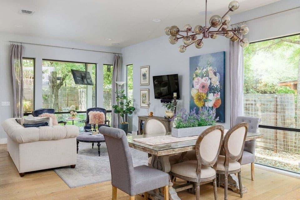 The Watson - open floor plan with a large living room, smart TV, & a music room