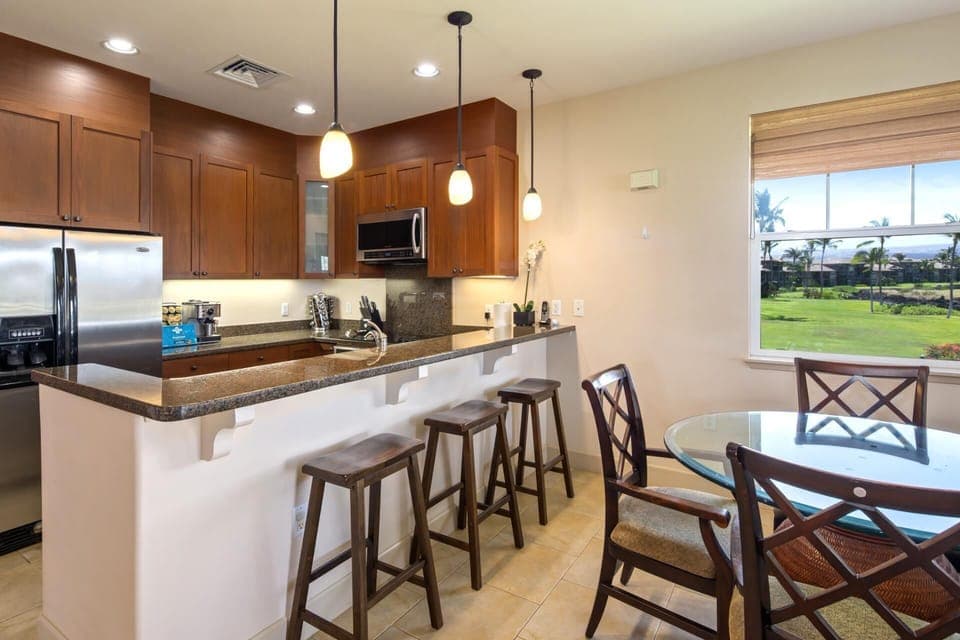 Modern island kitchen with open flow to the dining area and beautiful garden views  HLI-12A