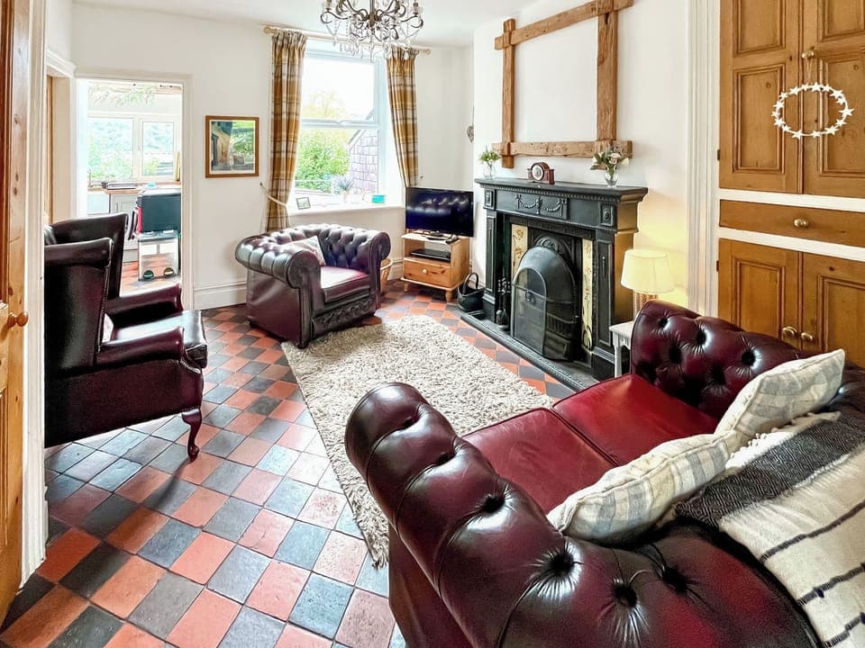 Lounge area with open fire | Wenallt Cottage, Nantlle, near Caernarfon