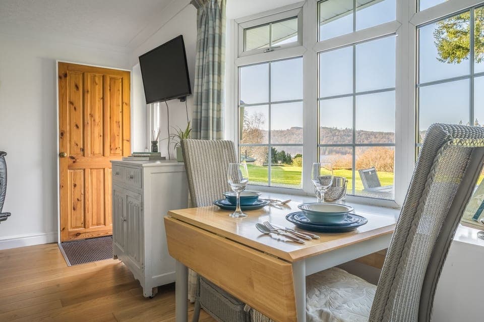 Dining table with lake view in 11 Priory Cottages in Windermere