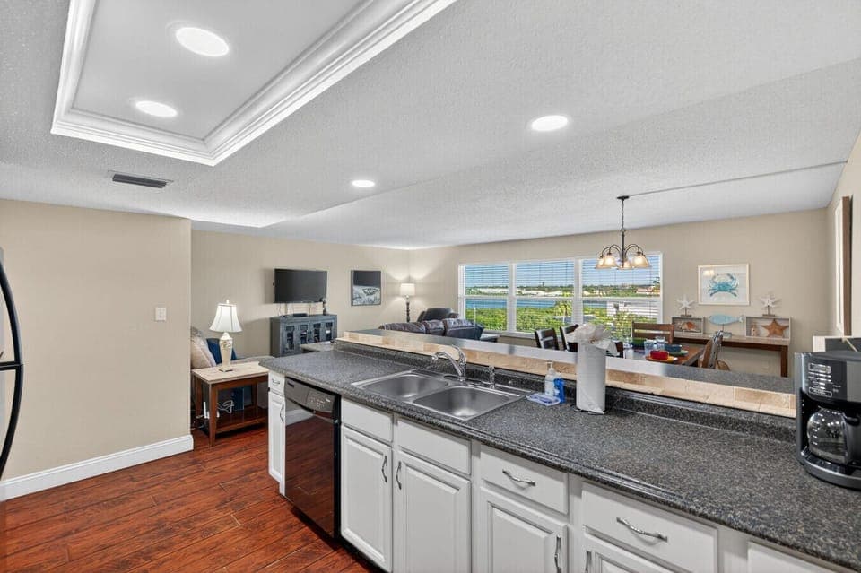 Open kitchen layout w/ generous prep space, making cooking and entertaining effortless.