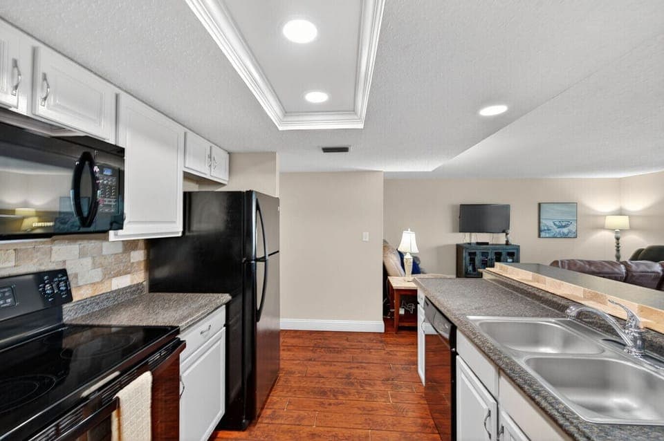 Fully equipped kitchen w/ sleek appliances and plenty of counter space for home-cooked meals.