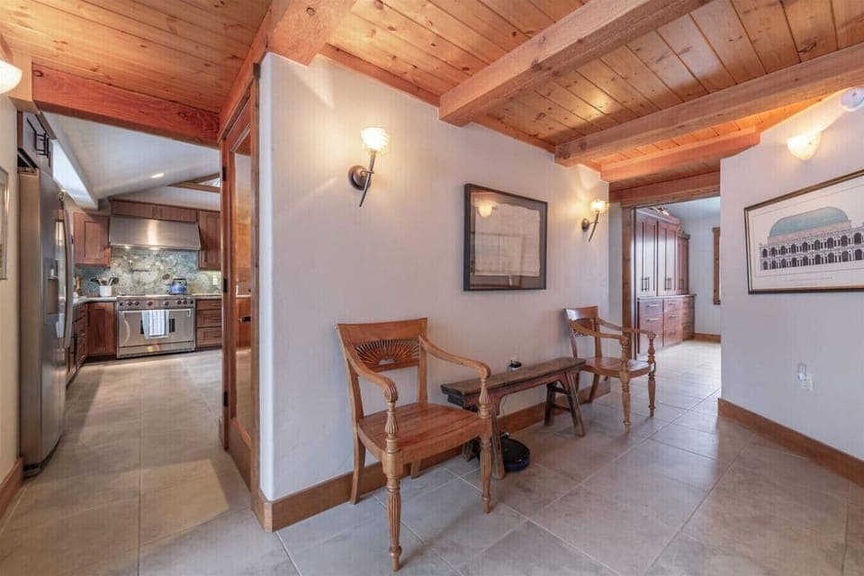 Transitional foyer / access to side patio area.