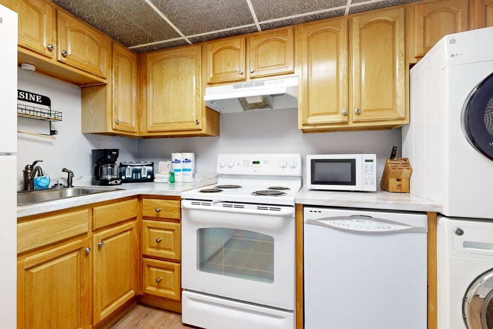 Kitchen delight awaits. And, whip up meals in style with modern appliances and warm wood cabinetry!
