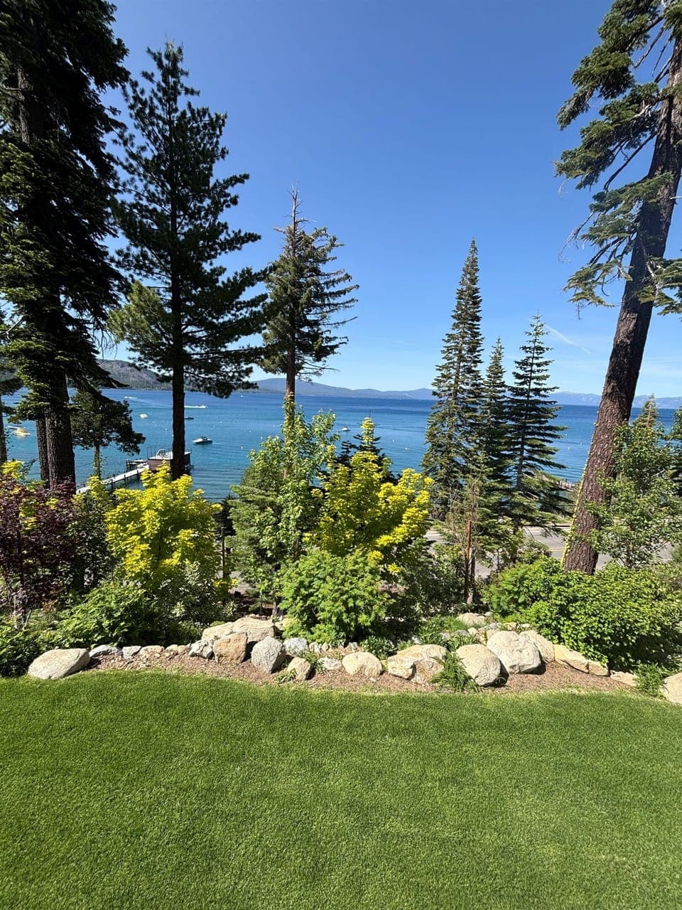 The view from the deck in the summertime.  We have a nice lawn area and deciduous landscaping.