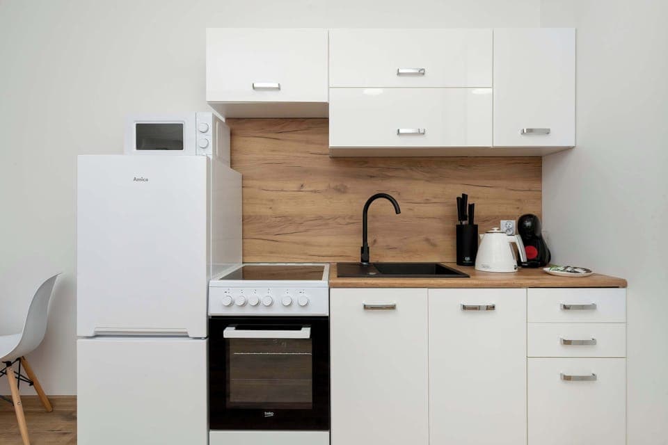 The fully equipped kitchenette includes everything you need for a home-cooked meal.