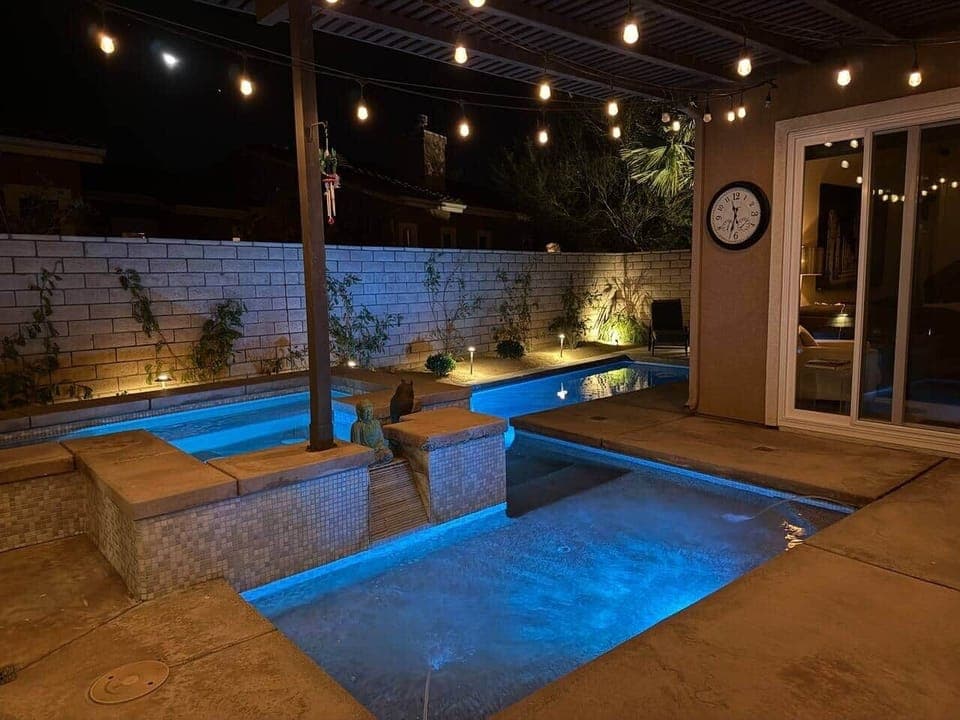 Salt water pool and jacuzzi, covered patio, and outdoor grill.