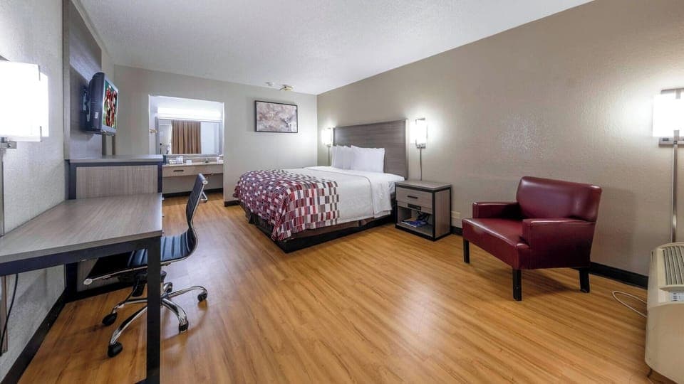 Settle into a roomy retreat with lounge chair and workspace.