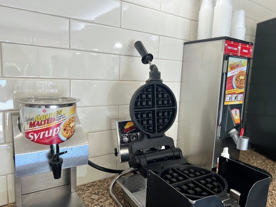Treat yourself to warm waffles and sweet toppings at breakfast.