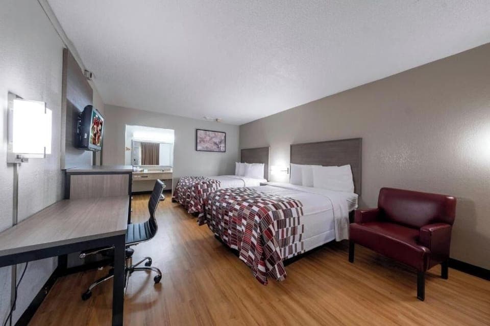 Settle into a bright double-queen room with cozy seating.