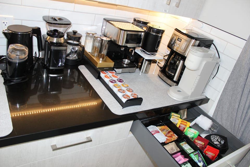 Coffee/tea station w/espresso, Keurig, drip, etc. Coffee & tea included.