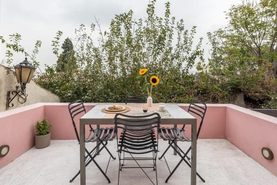 Dine alfresco under open skies in a private terrace setting.