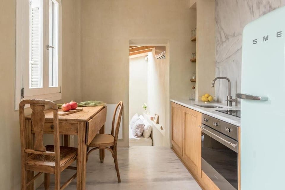 Cook and linger over meals at the charming wooden table.