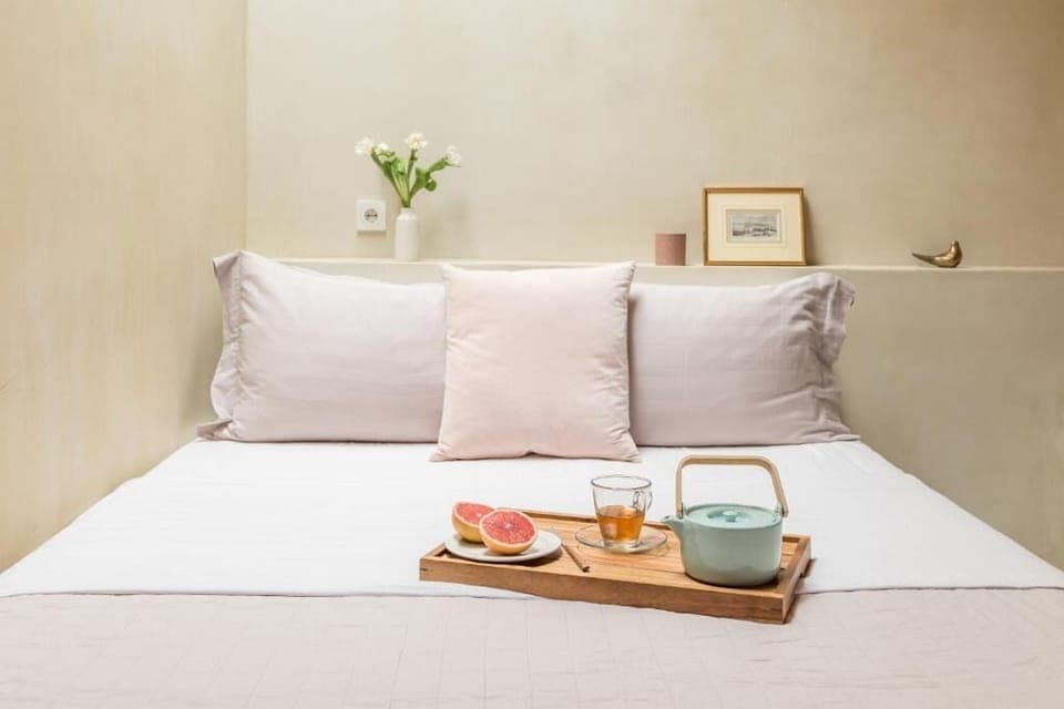 Wake up slowly with breakfast in bed and soft linens.