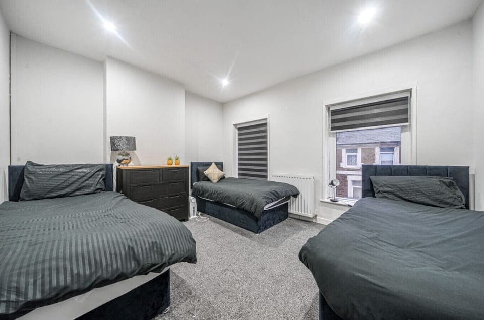 Triple bedroom with soft lighting