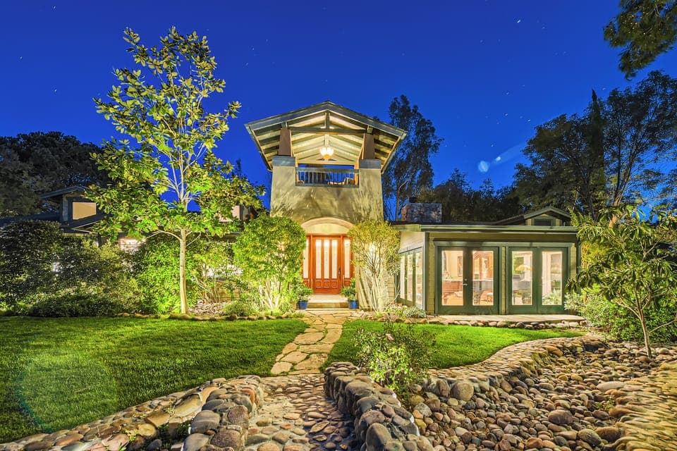Welcome! Cross the bridge over the dry stream bed to our front entry.
