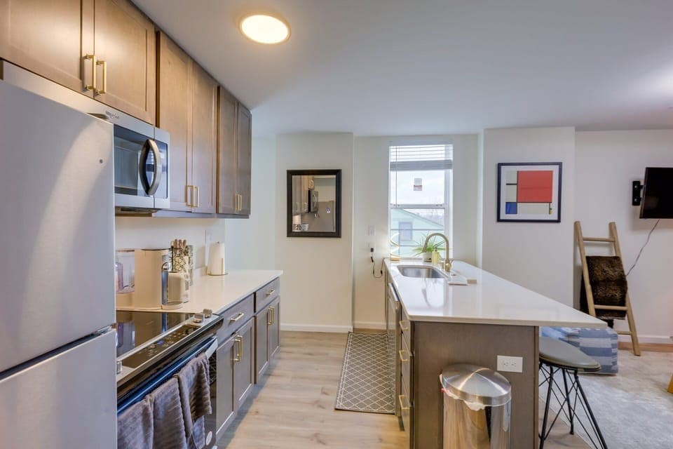 Modern kitchen design effects, gold tone fixtures, soft close cabinets & drawers