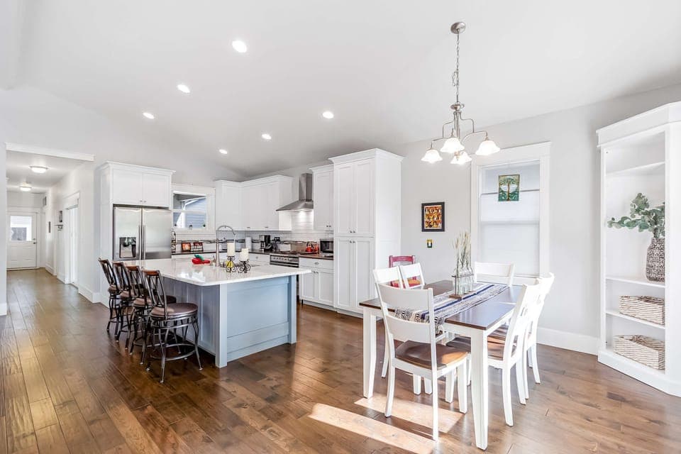 A spacious, open-concept kitchen and dining area is perfect for family dinners or enjoying board games together.