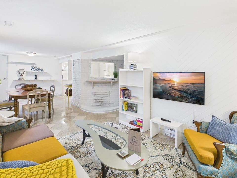 Gather around the tufted sofa in this bright and enjoy movie nights with our 43" Smart TV