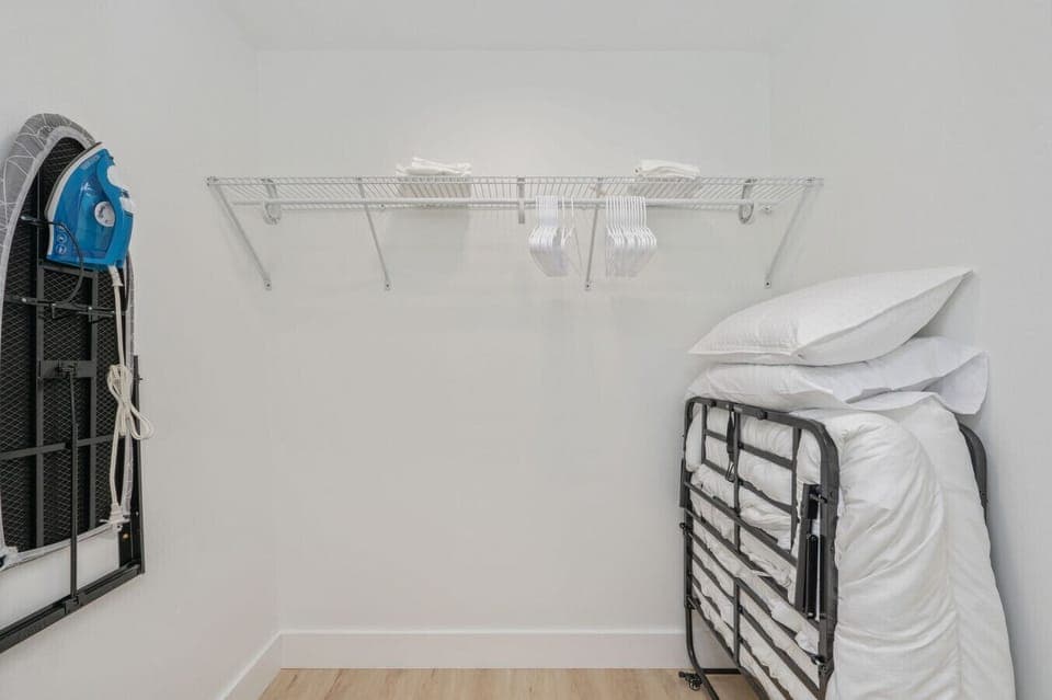 Designated space to hang clothes and iron with ease.
