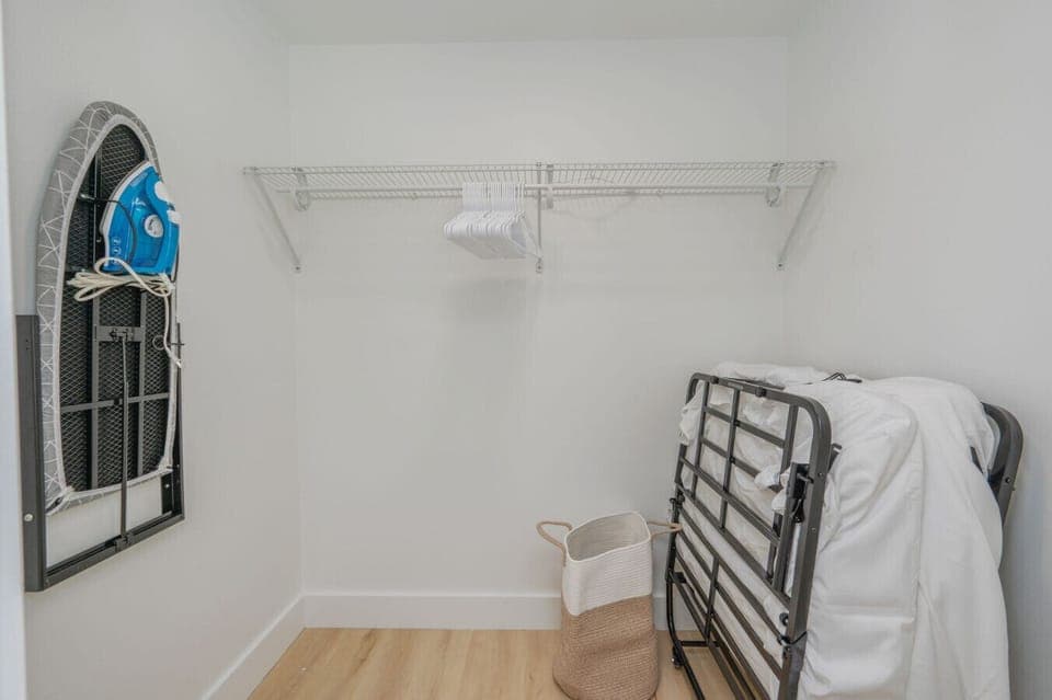 Designated space to hang clothes and iron with ease.