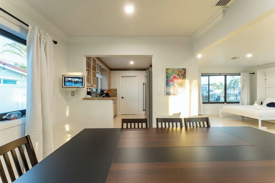 Central dining space with easy flow to the kitchen and living room.