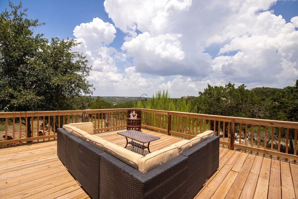 A comfortable outdoor lounge setup with sectional seating and scenic views perfect for relaxing after a workday or spending time with family and friends.