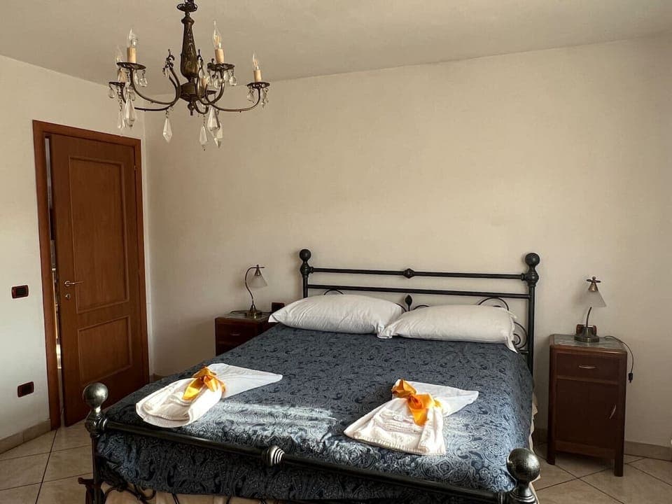 Main bedroom with elegant decor and double bed