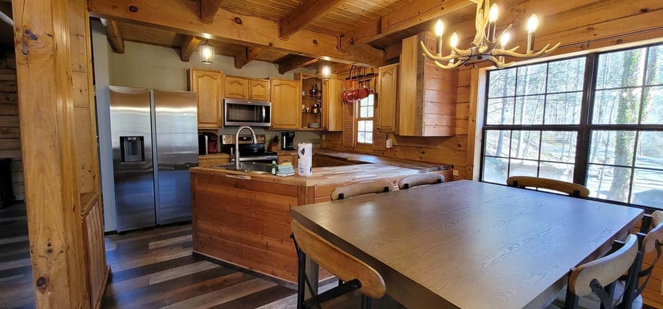 Rustic charm meets modern convenience in this stunning kitchen space!