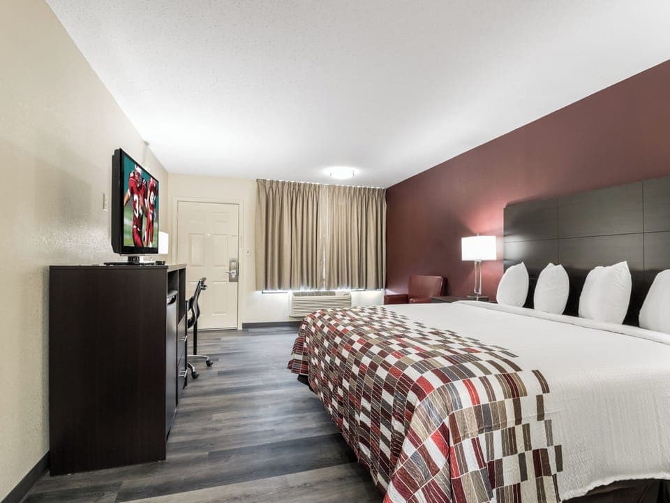 Recharge in a calm, spacious room with cozy bedside glow.