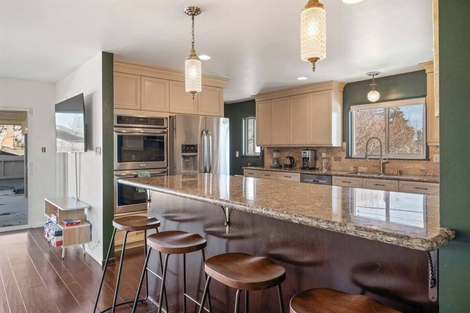 Kitchen island and bar seating, perfect for cooking and entertaining.