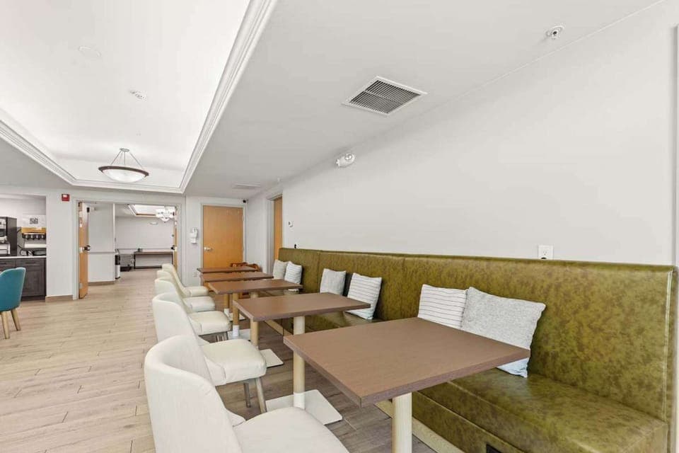 Dining area with booth seating and soft pillows