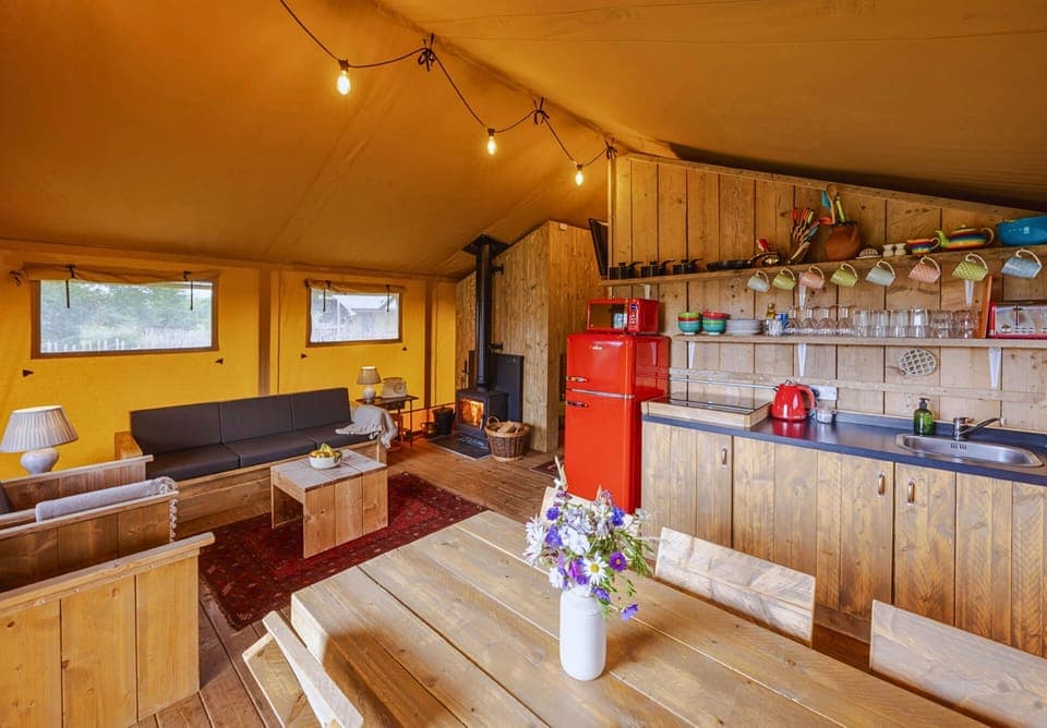 Open-plan kitchen, dining and sitting area, glamping in Yorkshire