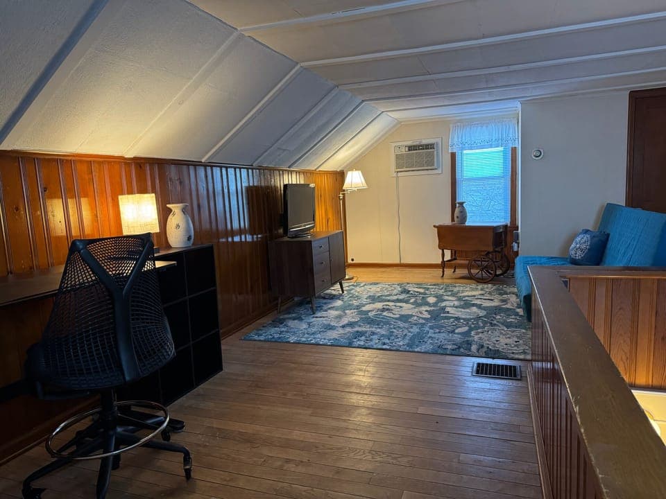 Bungalow office with sleeper couch.