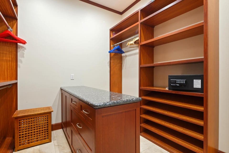 The walk-in closet and dressing area in the primary suite offer ample storage.