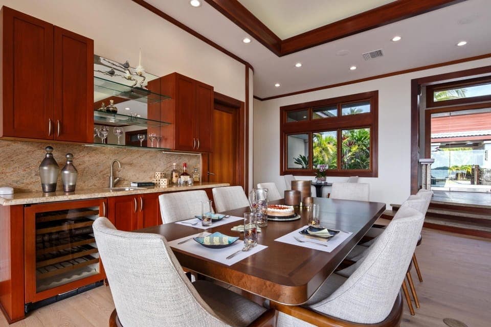 Wood finishes and soft lighting create an inviting space for shared meals.