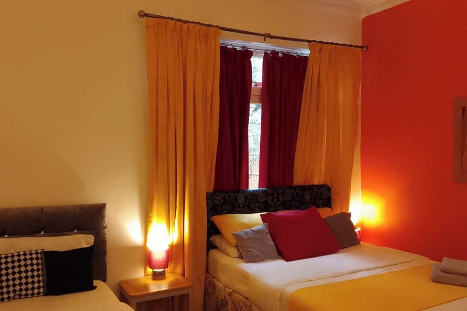 Bright and comfortable second bedroom with hotel-quality bedding.
