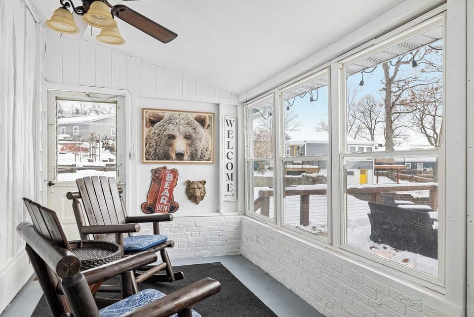 Relax in the sunny three-season room, perfect for enjoying the outdoors in comfort during spring, summer, and fall.