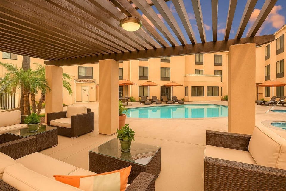 Covered outdoor lounge beside pool area