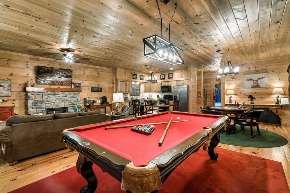 Spacious game room featuring a classic red felt pool table.