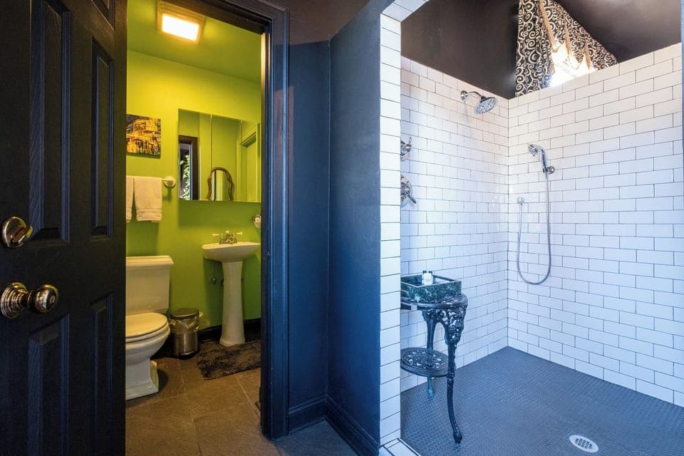 Private bathroom with walk-in shower and bold, modern tilework.