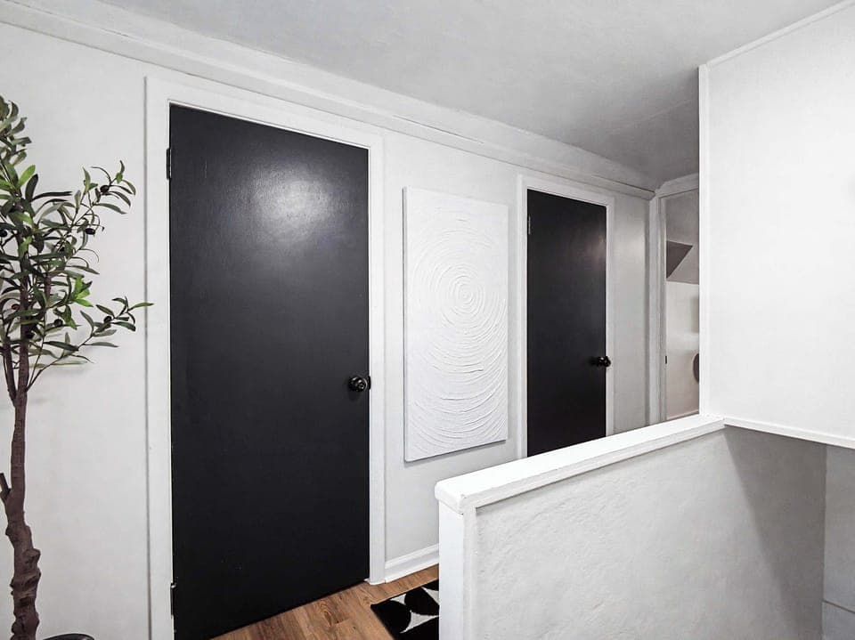 Hallway view w/ clean lines, modern doors & simple styling