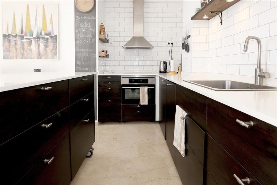 Modern open kitchen is fully equipped with all the appliances