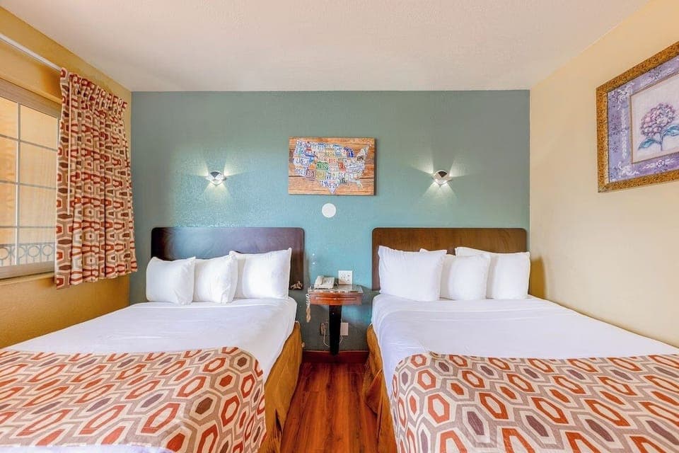 Unwind in bright double beds with crisp linens.