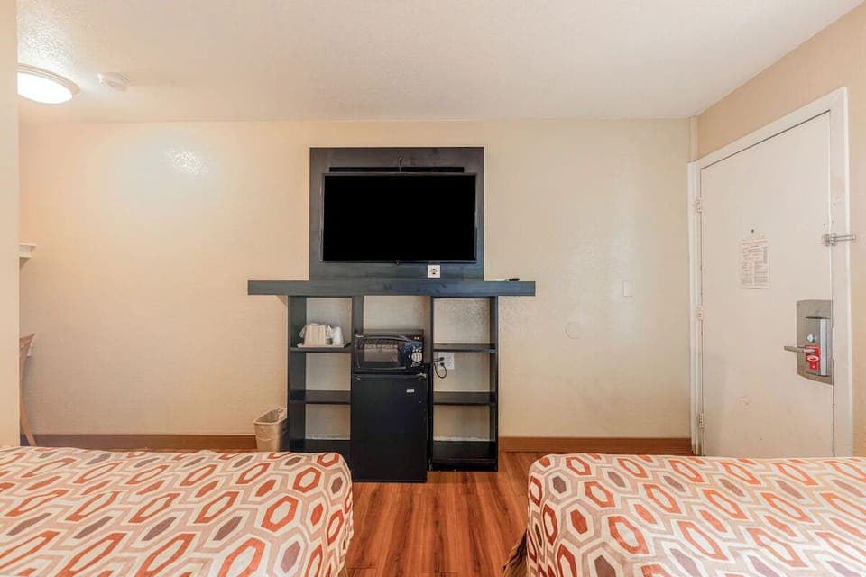 Settle in with in-room TV and convenient storage.