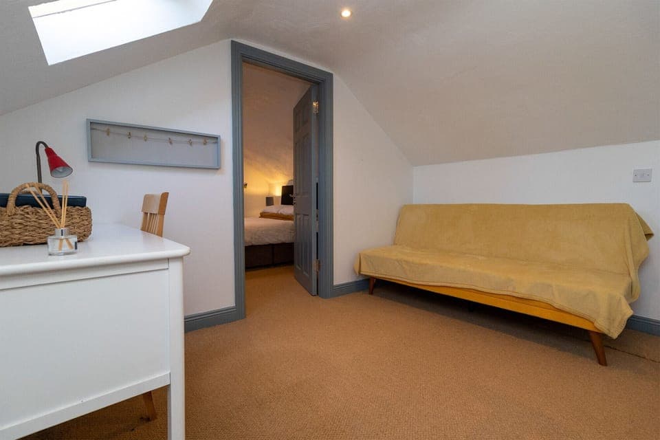 Brittas Bay Holiday Park No 7.  Attic room, sofa, simple style.